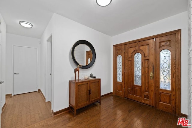 foyer entrance with wood-type flooring