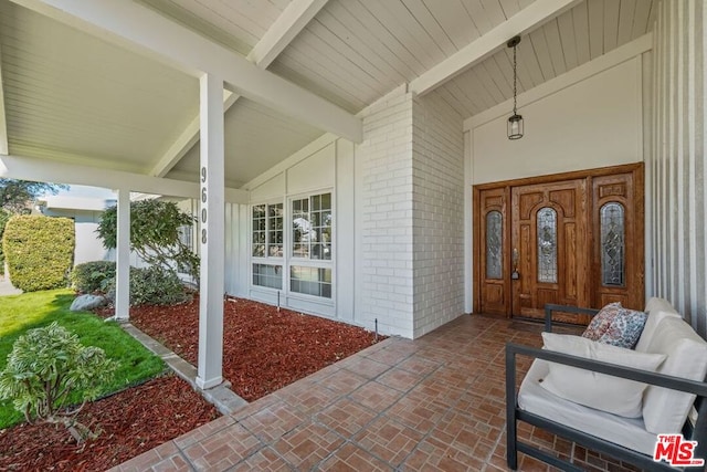 doorway to property featuring a porch