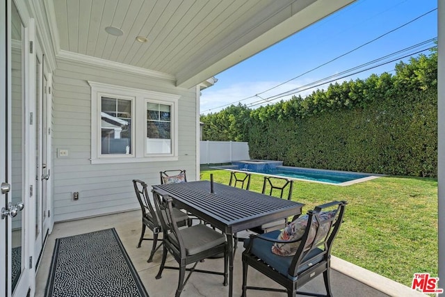 view of patio with a fenced in pool