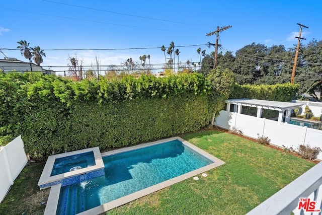 view of swimming pool with an in ground hot tub and a lawn