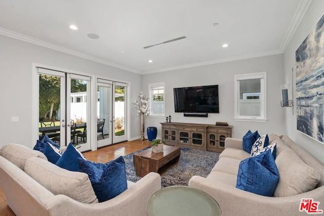 living room featuring crown molding and wood-type flooring