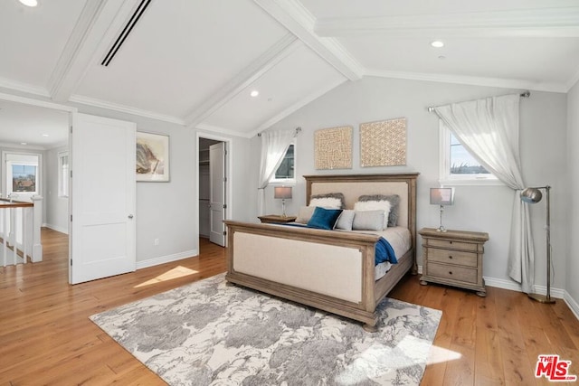 bedroom featuring vaulted ceiling with beams, ornamental molding, and light wood-type flooring