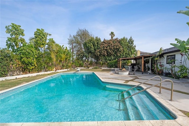 view of swimming pool with a patio