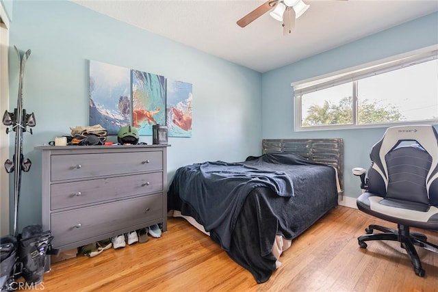 bedroom featuring ceiling fan and light hardwood / wood-style floors