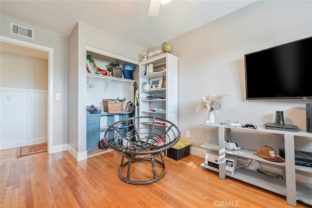 interior space with ceiling fan and light hardwood / wood-style flooring