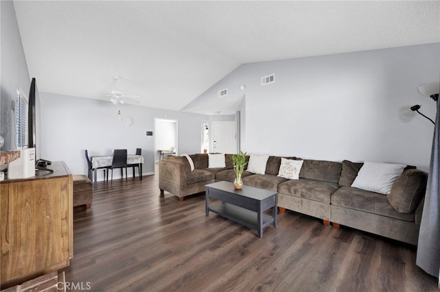 living room with ceiling fan, lofted ceiling, and dark hardwood / wood-style flooring