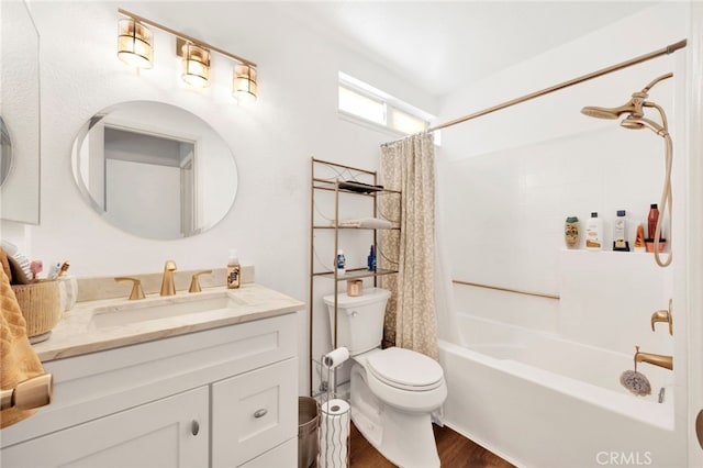 full bathroom featuring vanity, hardwood / wood-style floors, shower / bath combination with curtain, and toilet