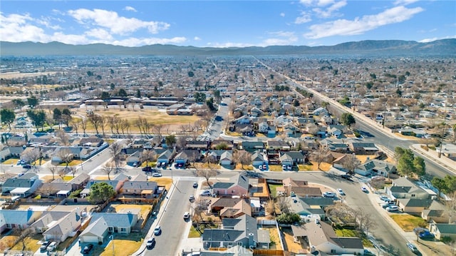 birds eye view of property featuring a mountain view