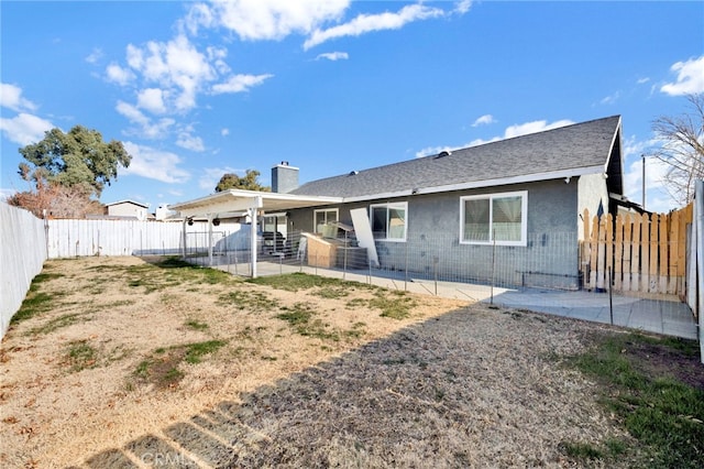 back of property featuring a patio