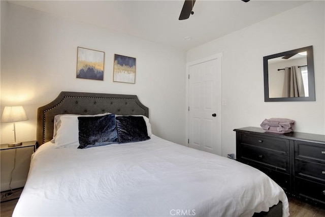 bedroom featuring dark wood-type flooring and ceiling fan