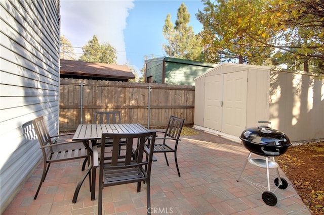 view of patio with a storage shed