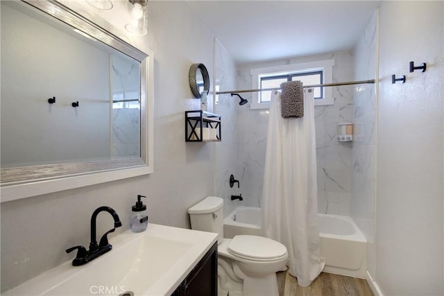 full bathroom featuring vanity, wood-type flooring, toilet, and shower / bath combo with shower curtain