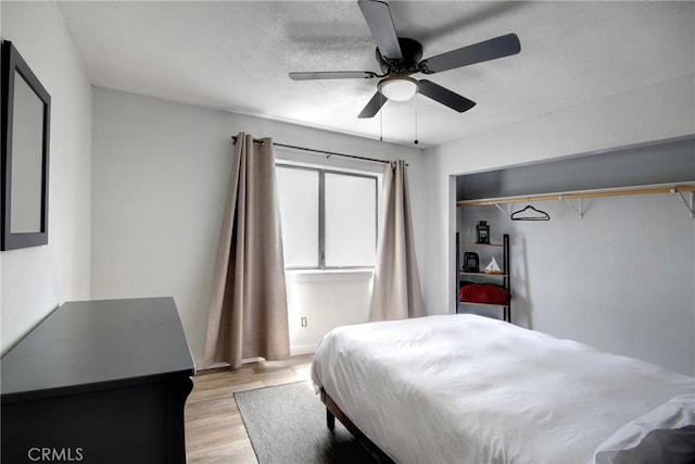 bedroom featuring ceiling fan and light wood-type flooring