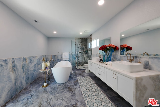 full bathroom with vanity, toilet, independent shower and bath, and tile walls