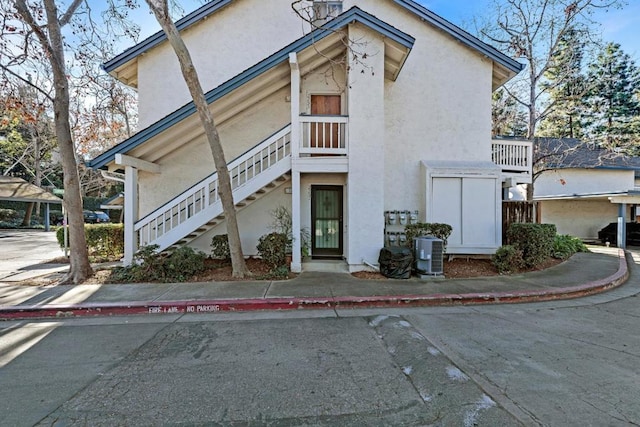 view of side of home featuring central AC unit