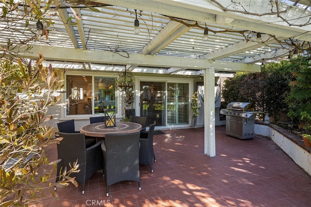 view of patio / terrace featuring area for grilling and a pergola