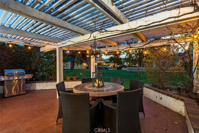 view of patio / terrace with area for grilling and a pergola