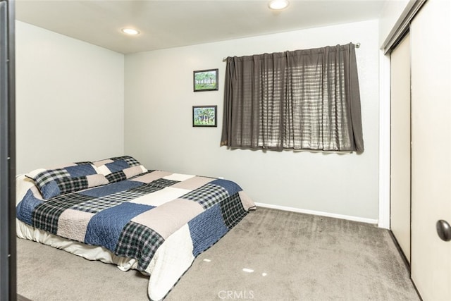 carpeted bedroom featuring a closet