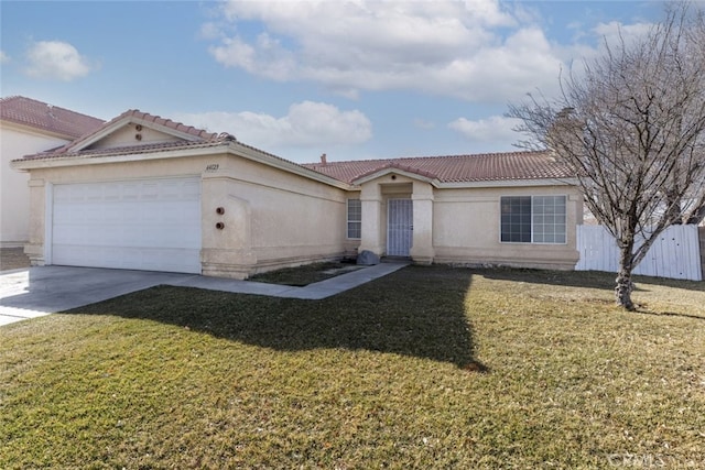 view of front of property featuring a garage and a front lawn