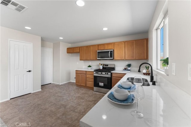 kitchen with appliances with stainless steel finishes and sink