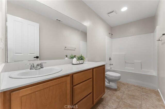 full bathroom with tile patterned floors, vanity, toilet, and  shower combination