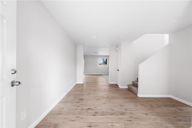 hallway featuring light hardwood / wood-style flooring