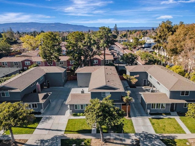 birds eye view of property with a mountain view