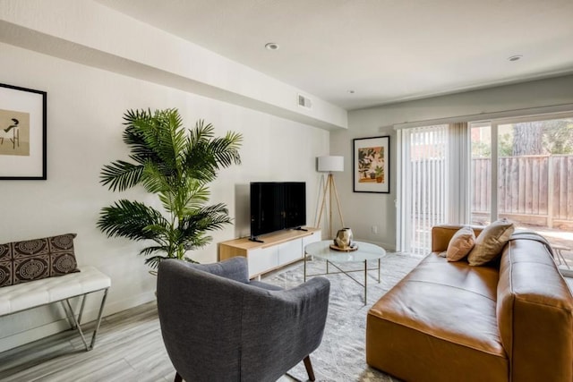 living room with light hardwood / wood-style floors