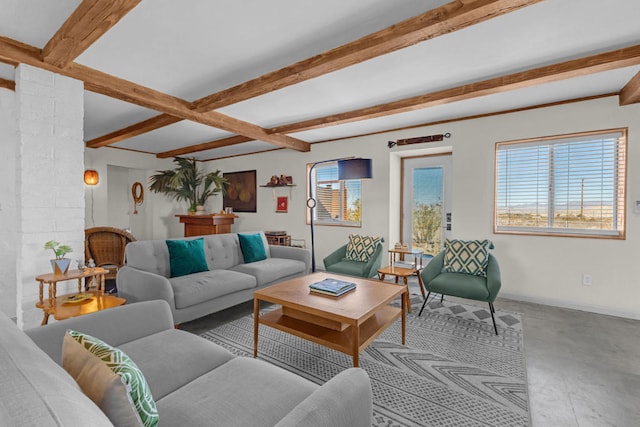 living room with beamed ceiling and concrete floors