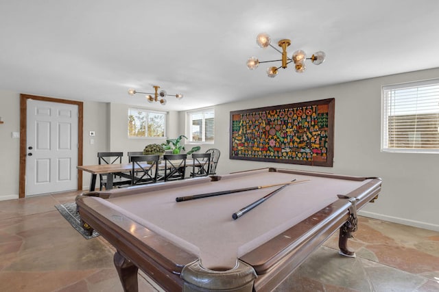 game room featuring pool table and a notable chandelier