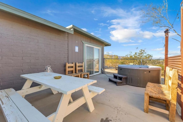 view of patio / terrace featuring a hot tub