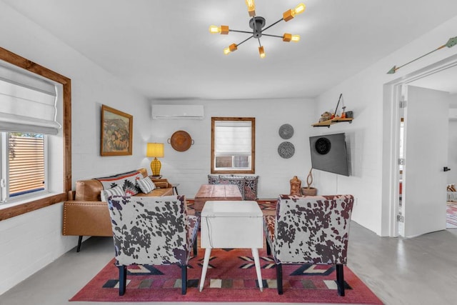 dining space with an inviting chandelier, a wall unit AC, and concrete floors