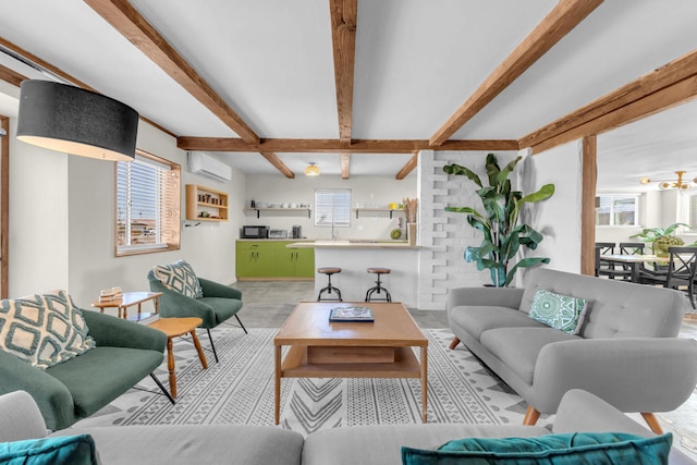 living room featuring beam ceiling, plenty of natural light, coffered ceiling, and a wall unit AC