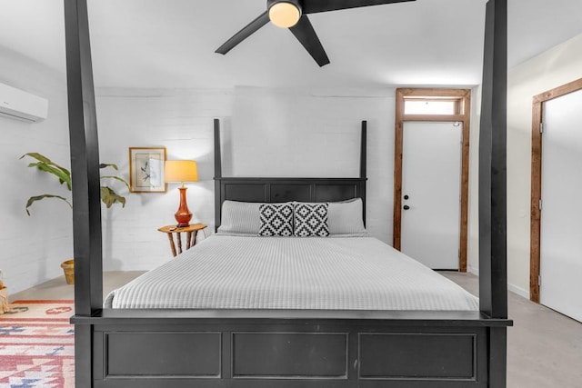 bedroom with a wall mounted air conditioner and ceiling fan