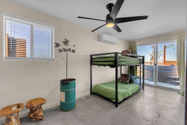 bedroom featuring ceiling fan, access to exterior, concrete floors, and an AC wall unit