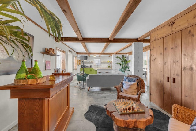 sitting room with beam ceiling