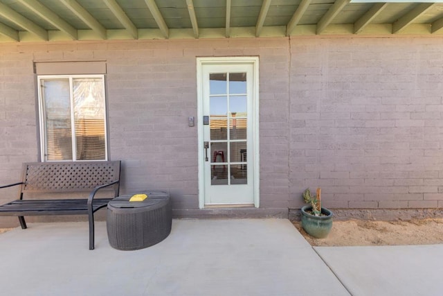 doorway to property with a patio area