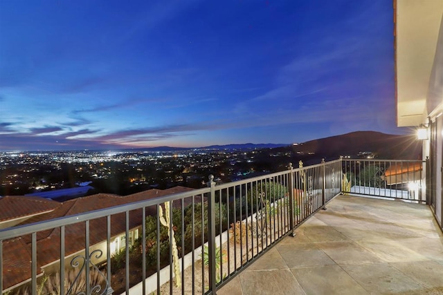 balcony at dusk with a mountain view