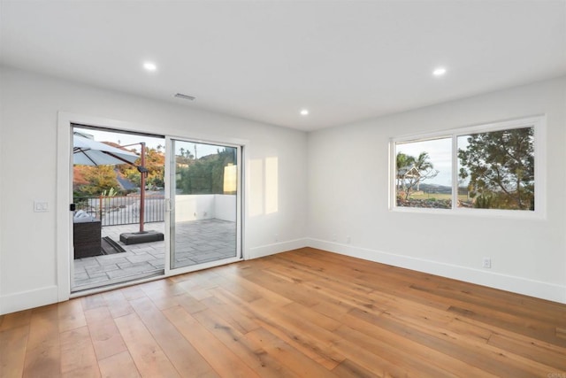 spare room featuring hardwood / wood-style floors