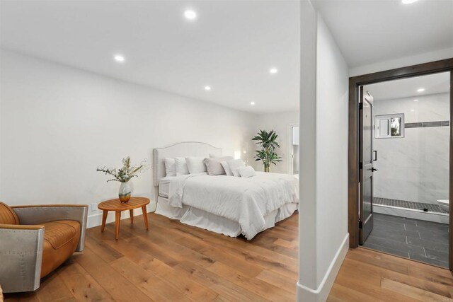 bedroom with hardwood / wood-style flooring