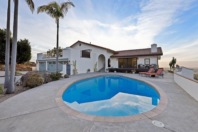 view of swimming pool featuring an outdoor living space and a patio