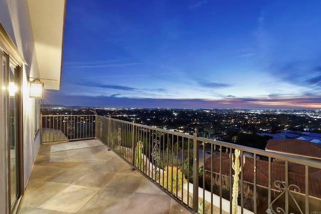 view of balcony at dusk