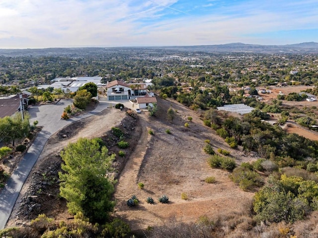 drone / aerial view featuring a mountain view