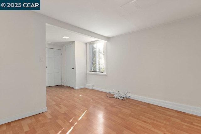 unfurnished room with light hardwood / wood-style flooring