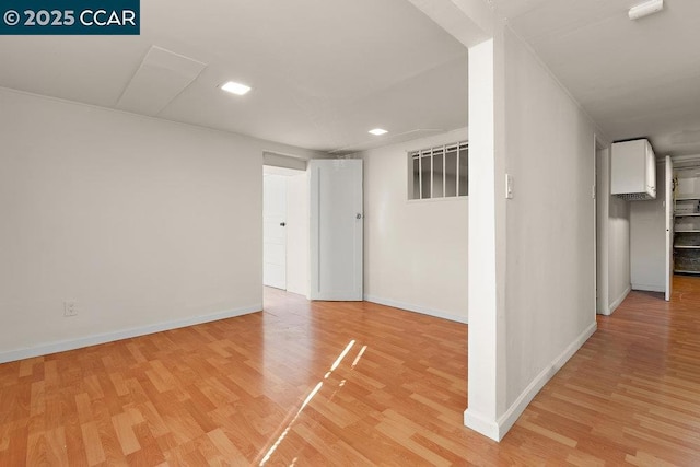 unfurnished room with light hardwood / wood-style flooring