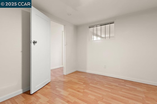 spare room featuring light hardwood / wood-style flooring