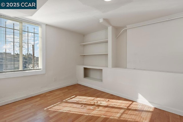 interior space with a healthy amount of sunlight and hardwood / wood-style floors