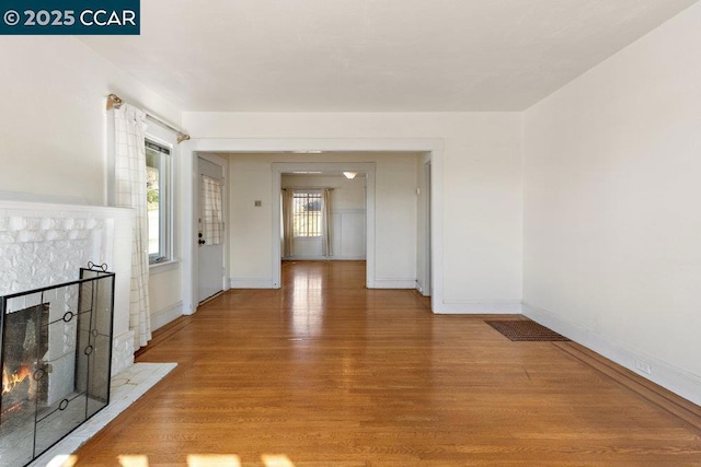 unfurnished living room with light wood-type flooring