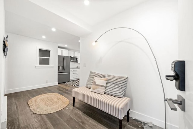 living area with dark hardwood / wood-style flooring