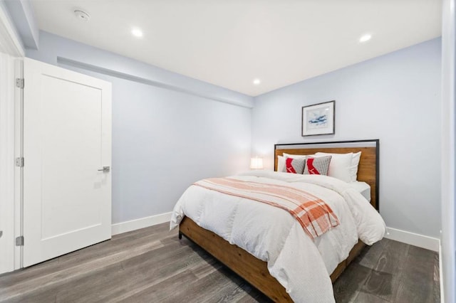 bedroom featuring dark hardwood / wood-style flooring